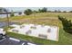 Common area with benches, string lights and white gravel for residents to relax and enjoy the outdoors at 6009 Sea Ranch Dr # 107E, Hudson, FL 34667
