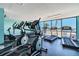 Fitness center with treadmills and elliptical machines overlooking the ocean for scenic workouts at 6009 Sea Ranch Dr # 107E, Hudson, FL 34667