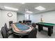 A game room with a poker table, foosball table, and a mini pool table at 6009 Sea Ranch Dr # 107E, Hudson, FL 34667