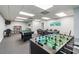Spacious game room featuring a foosball table, poker table, mini pool table, and reading nook at 6009 Sea Ranch Dr # 107E, Hudson, FL 34667