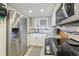 Well-equipped kitchen boasting stainless steel appliances and sleek white cabinets for a modern cooking experience at 6009 Sea Ranch Dr # 107E, Hudson, FL 34667