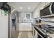 Modern kitchen featuring stainless steel appliances, white cabinets, and ample counter space for cooking at 6009 Sea Ranch Dr # 107E, Hudson, FL 34667