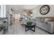 Bright living room features wood-look tile flooring and an open floor plan at 6009 Sea Ranch Dr # 107E, Hudson, FL 34667