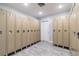 Clean locker room with rows of metal lockers and stylish tile flooring at 6009 Sea Ranch Dr # 107E, Hudson, FL 34667
