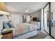 Bright main bedroom with access to the balcony and an ensuite bathroom at 6009 Sea Ranch Dr # 107E, Hudson, FL 34667