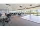 Large meeting room with tables and chairs, a dance floor, and scenic views from large windows at 6009 Sea Ranch Dr # 107E, Hudson, FL 34667