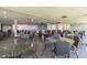 Large meeting room with tables and chairs with granite countertops along back wall, and scenic views from windows at 6009 Sea Ranch Dr # 107E, Hudson, FL 34667
