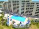 A beautiful in-ground swimming pool with lounge chairs and tables for residents of the condo at 6009 Sea Ranch Dr # 107E, Hudson, FL 34667