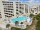 A beautiful in-ground swimming pool with lounge chairs and tables for residents of the condo at 6009 Sea Ranch Dr # 107E, Hudson, FL 34667