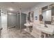 Well-maintained restroom with multiple stalls, sinks, and modern fixtures at 6009 Sea Ranch Dr # 107E, Hudson, FL 34667