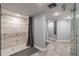 Modern shower room with marble tile, grab bars, and gray privacy curtains at 6009 Sea Ranch Dr # 107E, Hudson, FL 34667