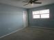 A cozy bedroom with a ceiling fan, neutral walls, and a window for natural light at 6015 19Th N St # 301, St Petersburg, FL 33714