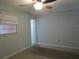 Bedroom featuring soothing walls, a ceiling fan, and a window for natural light at 6015 19Th N St # 301, St Petersburg, FL 33714