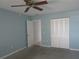 A primary bedroom featuring a neutral palette and a doorway that offers ample natural light at 6015 19Th N St # 301, St Petersburg, FL 33714