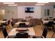 Relaxing common area with tables, chairs, and a TV for residents to enjoy activities and socializing at 6015 19Th N St # 301, St Petersburg, FL 33714