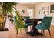 Relaxing area with a table and chairs next to a lush indoor plant at 6015 19Th N St # 301, St Petersburg, FL 33714