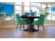 Inviting dining area with stylish chairs, modern table, and ample natural light for a welcoming ambiance at 6015 19Th N St # 301, St Petersburg, FL 33714