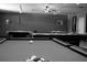 Bright game room featuring several pool tables and cue stick storage at 6015 19Th N St # 301, St Petersburg, FL 33714