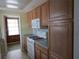 This kitchen features light oak cabinets, and white appliances, offering a practical and functional cooking space at 6015 19Th N St # 301, St Petersburg, FL 33714