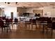Large meeting room with tables, chairs, stage, and piano at 6015 19Th N St # 301, St Petersburg, FL 33714