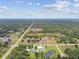 Aerial view of a beautiful country lot with home, barn, pond and pastures at 6080 Taneytown St, North Port, FL 34291