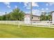 Barn on a large grassy lot with a white fence in a country setting at 6080 Taneytown St, North Port, FL 34291