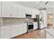 Modern kitchen featuring stainless steel appliances, granite countertops, and ample storage space at 6080 Taneytown St, North Port, FL 34291