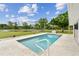 Relaxing pool with a beautiful view of the backyard and pond, perfect for summer days and peaceful relaxation at 6080 Taneytown St, North Port, FL 34291