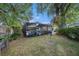 Spacious backyard with patio and lush trees at 616 Highview S Cir, Brandon, FL 33510