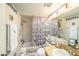 Classic bathroom featuring a shower-tub combination with ample storage and unique decorative elements at 616 Highview S Cir, Brandon, FL 33510