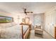 Inviting bedroom featuring a four-poster bed, soft lighting, and a cozy armchair for a relaxing retreat at 616 Highview S Cir, Brandon, FL 33510