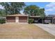 Single-story home featuring a carport and simple landscaping at 616 Highview S Cir, Brandon, FL 33510