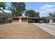 Single-story home featuring a carport and simple landscaping at 616 Highview S Cir, Brandon, FL 33510
