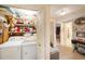 Hallway featuring access to rooms, storage, and a laundry area at 616 Highview S Cir, Brandon, FL 33510