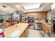 This kitchen features an island with counter seating, stainless steel appliances, and efficient layout at 616 Highview S Cir, Brandon, FL 33510