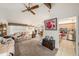 Open-concept living room with sofas, ceiling fan, and doorway to kitchen at 616 Highview S Cir, Brandon, FL 33510
