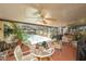 Covered patio with a ceiling fan, outdoor seating and a view of the pool at 616 Highview S Cir, Brandon, FL 33510
