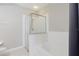 Bathroom featuring white tiled shower/tub combo with glass door and modern fixtures at 6260 Olivedale Dr, Riverview, FL 33578