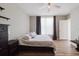 Cozy bedroom with wood floors, ceiling fan, and ensuite bathroom at 6260 Olivedale Dr, Riverview, FL 33578