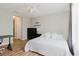 Inviting bedroom featuring a ceiling fan and wood-look flooring at 6260 Olivedale Dr, Riverview, FL 33578