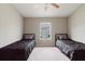 Neutral bedroom featuring two twin beds, carpeted floor, and a window at 6260 Olivedale Dr, Riverview, FL 33578