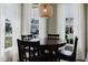 Cozy dining area bathed in natural light from surrounding windows at 6260 Olivedale Dr, Riverview, FL 33578