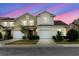 Charming two-story home boasts a well-maintained lawn and attached two-car garage at 6260 Olivedale Dr, Riverview, FL 33578