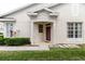 A welcoming entrance with a quaint porch and lush green landscaping at 6260 Olivedale Dr, Riverview, FL 33578