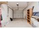 Spacious two-car garage with shelving, storage space and concrete floor at 6260 Olivedale Dr, Riverview, FL 33578