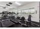 Well-equipped gym featuring modern treadmills, elliptical machine, and weight training equipment at 6260 Olivedale Dr, Riverview, FL 33578