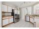 Bright kitchen with stainless steel refrigerator, appliances, and white cabinets at 6260 Olivedale Dr, Riverview, FL 33578