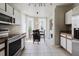 Spacious kitchen with modern appliances and adjacent dining area at 6260 Olivedale Dr, Riverview, FL 33578