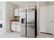Kitchen features stainless steel refrigerator, white cabinets, and light-colored countertops at 6260 Olivedale Dr, Riverview, FL 33578