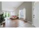 Spacious living room featuring hardwood floors, large windows, and neutral decor at 6260 Olivedale Dr, Riverview, FL 33578